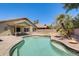 Sparkling backyard pool with a meticulously designed patio, lush landscaping, and tranquil desert surroundings at 1037 E Baylor Ln, Gilbert, AZ 85296