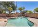 Backyard pool with lush tropical landscaping creates a private desert oasis at 1037 E Baylor Ln, Gilbert, AZ 85296