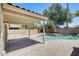 Landscaped backyard with a pool and a covered patio, perfect for outdoor entertaining at 1037 E Baylor Ln, Gilbert, AZ 85296