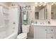 Clean bathroom with shower-tub combo, neutral wall color and white vanity with updated fixtures at 10516 W Peoria Ave, Sun City, AZ 85351