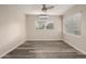 Bedroom featuring new floors and abundant natural light through multiple windows at 10516 W Peoria Ave, Sun City, AZ 85351