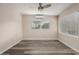 Bedroom featuring new floors, a ceiling fan, and lots of natural light at 10516 W Peoria Ave, Sun City, AZ 85351