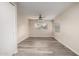 Bedroom with new floors and ample natural light from two large windows at 10516 W Peoria Ave, Sun City, AZ 85351