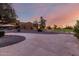 A community center and wide open space with benches and sunset at 10516 W Peoria Ave, Sun City, AZ 85351