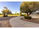 Long concrete driveway leading to the home, surrounded by desert landscaping at 10516 W Peoria Ave, Sun City, AZ 85351