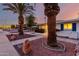 Charming home with palm trees, well-maintained landscaping, and a wide driveway at 10516 W Peoria Ave, Sun City, AZ 85351
