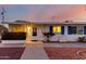 Inviting home with blue shutters, well-maintained landscaping, and a welcoming front entrance at 10516 W Peoria Ave, Sun City, AZ 85351