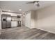 Updated kitchen featuring stainless steel appliances, white cabinets, and modern floors at 10516 W Peoria Ave, Sun City, AZ 85351