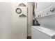 Convenient laundry area with stackable washer and dryer, and decorative accents at 10516 W Peoria Ave, Sun City, AZ 85351