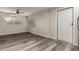 A living room featuring new floors, a ceiling fan, and ample natural light at 10516 W Peoria Ave, Sun City, AZ 85351