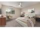 Inviting bedroom with neutral decor, soft lighting, a comfortable bed, and modern furnishings, virtually staged at 10516 W Peoria Ave, Sun City, AZ 85351