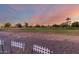Open green space and common area in front of residential homes at 10516 W Peoria Ave, Sun City, AZ 85351