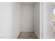 An empty storage closet with an open door at 10516 W Peoria Ave, Sun City, AZ 85351