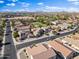 The image shows a bird's eye view of the community, parks, streets, and desert landscape background at 1124 E Jahns Dr, Casa Grande, AZ 85122