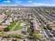 An aerial shot shows community amenities, lush green spaces, and convenient access to nearby shopping and dining at 1124 E Jahns Dr, Casa Grande, AZ 85122