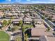 A high-angle aerial shot shows spacious yards and neighborhood streets with easy access to green spaces at 1124 E Jahns Dr, Casa Grande, AZ 85122