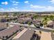 An aerial perspective presents well-maintained homes and streets, and easy access to green space at 1124 E Jahns Dr, Casa Grande, AZ 85122