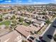 An aerial view presents spacious yards and convenient access to well-maintained neighborhood roads and green spaces at 1124 E Jahns Dr, Casa Grande, AZ 85122