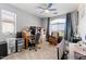 Bedroom with a ceiling fan, a large window, and gray walls at 1124 E Jahns Dr, Casa Grande, AZ 85122