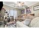 Cozy bonus room with large sectional sofa and sports memorabilia at 1124 E Jahns Dr, Casa Grande, AZ 85122