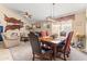 Elegant dining room featuring a wooden table, upholstered chairs, and stylish lighting at 1124 E Jahns Dr, Casa Grande, AZ 85122