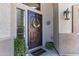 Inviting front entryway with a decorative security door, plants, and a 'Welcome' mat at 1124 E Jahns Dr, Casa Grande, AZ 85122
