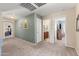 Hallway provides access to bedrooms and bathrooms with neutral colors and carpet at 1124 E Jahns Dr, Casa Grande, AZ 85122