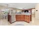 Open kitchen featuring granite countertops, stainless steel appliances, and convenient breakfast bar at 1124 E Jahns Dr, Casa Grande, AZ 85122