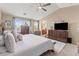 Serene main bedroom with a cozy bed, a large dresser, and lots of natural light at 1124 E Jahns Dr, Casa Grande, AZ 85122