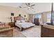 Spacious main bedroom with a large bed, vaulted ceiling, and elegant furnishings at 1124 E Jahns Dr, Casa Grande, AZ 85122
