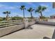 Wide angle view of the balcony, surrounded by lush, mature palm trees at 11257 E Reginald Ave, Mesa, AZ 85212