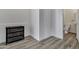 Bright half-bathroom showcasing wood-look flooring, white walls, and a decorative chest of drawers at 11257 E Reginald Ave, Mesa, AZ 85212