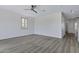 Bedroom features light walls, wood-style flooring, and ceiling fan for comfortable living at 11257 E Reginald Ave, Mesa, AZ 85212