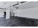 The garage has a black-stained concrete floor and plenty of room for parking and storage at 11257 E Reginald Ave, Mesa, AZ 85212