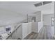 Bright hallway features stylish flooring, neutral walls, and natural light leading into adjacent rooms at 11257 E Reginald Ave, Mesa, AZ 85212