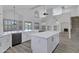 Spacious kitchen with quartz countertops, stainless appliances, and bright white trim at 11257 E Reginald Ave, Mesa, AZ 85212