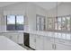 Bright eat-in kitchen featuring quartz countertops, stainless appliances, and shutters at 11257 E Reginald Ave, Mesa, AZ 85212