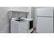 The laundry room has a new washer and dryer and a shelf at 11257 E Reginald Ave, Mesa, AZ 85212
