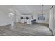 Spacious living area with open layout, recessed lights, and views of the kitchen and dining space at 11257 E Reginald Ave, Mesa, AZ 85212