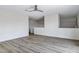 Open loft features wood-style flooring and neutral walls, creating a flexible living space at 11257 E Reginald Ave, Mesa, AZ 85212