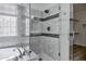 Close-up of luxurious shower featuring custom tile work, glass enclosure and showerhead at 11257 E Reginald Ave, Mesa, AZ 85212