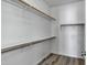 Walk-in closet with multiple shelves and rods for ample storage at 11257 E Reginald Ave, Mesa, AZ 85212