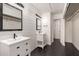 Beautiful bathroom with dual vanities, modern fixtures, shiplap walls, and matte black accents throughout at 1621 N Chippewa Dr, Chandler, AZ 85224