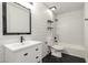 Updated bathroom featuring modern fixtures, shiplap walls, and a shower-tub combination with tile surround at 1621 N Chippewa Dr, Chandler, AZ 85224