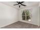 Cozy bedroom with new carpet, and a bright window providing a refreshing view of the outdoor landscape at 1621 N Chippewa Dr, Chandler, AZ 85224