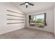 Bright bedroom with vaulted ceilings, modern light fixture, and a large window showcasing the exterior at 1621 N Chippewa Dr, Chandler, AZ 85224