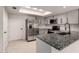 Updated kitchen with white cabinets, granite countertops, stainless steel appliances, and subway tile backsplash at 1621 N Chippewa Dr, Chandler, AZ 85224