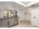 Stylish kitchen with stainless steel appliances, granite countertops, sleek cabinetry, and a view of the backyard at 1621 N Chippewa Dr, Chandler, AZ 85224