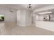 Open layout featuring kitchen with granite counters and living area with modern lighting at 1621 N Chippewa Dr, Chandler, AZ 85224