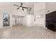 Open-concept living space featuring tile floors, high ceilings, and seamless flow into the kitchen at 1621 N Chippewa Dr, Chandler, AZ 85224